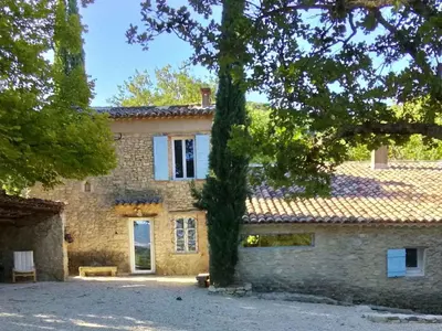 an old stone house with a tree in front of it at Holiday Home Domaine Santonne by Interhome in Apt