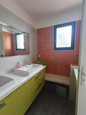 a bathroom with a sink and a mirror at ChloLéa in Caromb