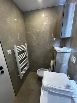 a small bathroom with a toilet and a sink at Studio 2 personnes maximum in Saint-Andiol