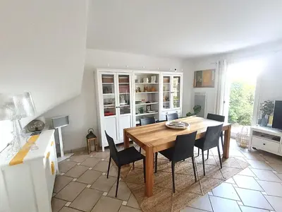 a kitchen with a dining room table and chairs at Maison climatisée 6 pers. avec piscines au Domaine Pont Royal - FR-1-658-38 in Mallemort