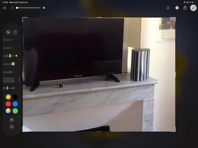 a flat screen tv sitting on top of a fireplace at appartement de charme au coeur d'aix en provence in Aix-en-Provence