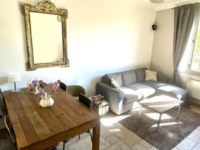 a living room with a couch and a table at Cocon en Provence à Ménerbes in Ménerbes