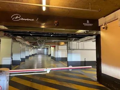 an empty hallway of a building with a sign on it at Downtown suite, parking, loggia, elevator, quiet in Aix-en-Provence
