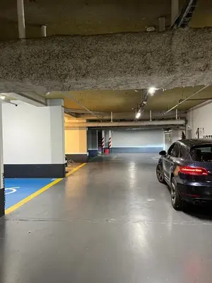 a parking garage with a car parked in it at Downtown suite, parking, loggia, elevator, quiet in Aix-en-Provence