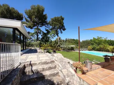 a backyard with a swimming pool and a house at Villa Cezanne Panorama, City Center on Foot in Aix-en-Provence