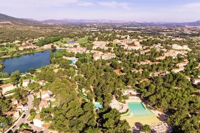 an aerial view of a resort with a lake at Village Pont Royal en Provence - maeva Home - Appartement vue vallée 2 pièces 4 personnes - Sélection MAE-6293 in Mallemort