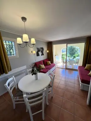 a living room with a white table and chairs at Village Pont Royal en Provence - maeva Home - Appartement 2 pièces 5 personnes - Sélection MAE-1083 in Mallemort