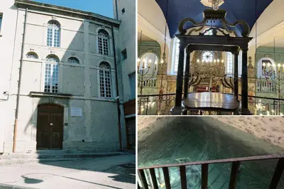 a church with a clock in front of a building at La Cour Secrète - 2 Suites avec Balnéo privée in Carpentras