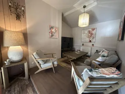 a living room with a couch and a table at luxury farm jacuzzi heated pool in Isle sur la sorgue in Lagnes