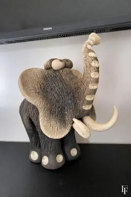 a statue of an elephant on top of a monitor at Villa Alberta Charming 10-person villa in Provence in Éguilles