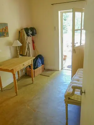 a room with a wooden table and a sliding door at Provençal House With Pool Near Roussillon in Roussillon