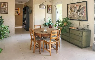 a dining room with a wooden table and chairs at Pet Friendly Home In Caromb in Caromb