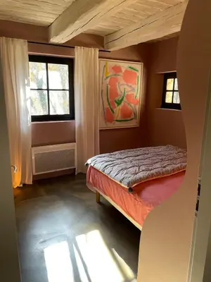 a small bedroom with a bed and a window at L'ISLE SUR LA SORGUE - Maison de prestige in Saumane-de-Vaucluse