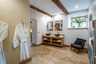 a bathroom with a sink and a mirror at Wine Estate With Sunset Courtyard Near Bédoin in Mazan