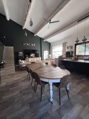 a large room with a wooden table and chairs at Splendid Loft in Provence in Robion en Luberon