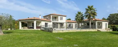 a large white house with a grass yard at Villa Peyriere-Ventoux in Carpentras