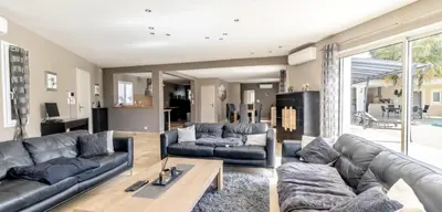 a living room with two couches and a table at Villa Peyriere-Ventoux in Carpentras