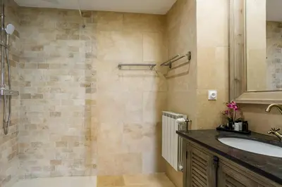 a bathroom with a sink and a shower at Bastide Vallonia Luxury & Serenity in the Heart of the Luberon in Murs