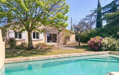 a swimming pool in front of a house at Maison Avec Piscine Privée in Mazan