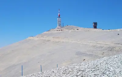 a hill with a lighthouse on top of it at Maison Avec Piscine Privée in Mazan