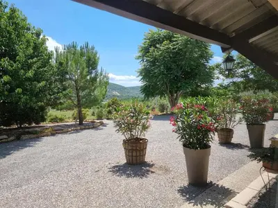 a group of potted plants sitting on the side of a road at Gîtes de la Coupière Le Mûrier in Aubenas-les-Alpes