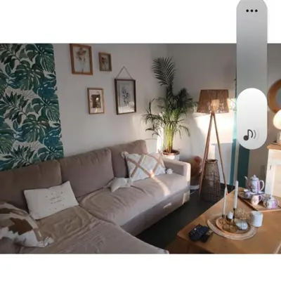 a living room with a couch and a table at Maison climatisée avec jaccuzi in Eyguières