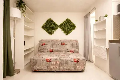 a bedroom with a bed and a chair in a room at Studio Aix Centre idéal séjour pro & tourisme in Aix-en-Provence