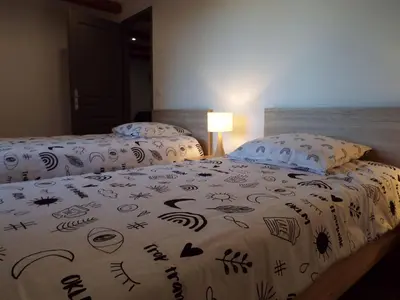 two beds sitting next to each other in a bedroom at Apartment Gîte Moulin de Tartay by Interhome in Avignon