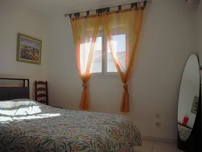 a bedroom with a bed and a window at Holiday Home by Interhome in Vernègues