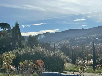 a view of a city from a hill with trees at Villa Lésina Bed & Breakfast in Apt