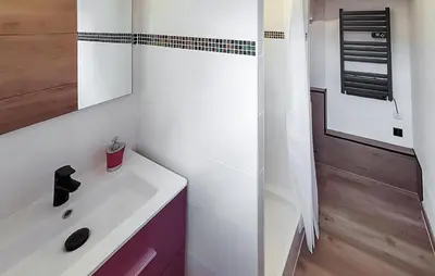 a white bathroom with a sink and a mirror at Nice Home In Jonquerettes in Jonquerettes