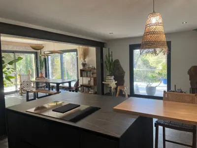 a kitchen with a large island with a counter top at Villa Luxury Lagoon - Aix en Provence in Ventabren