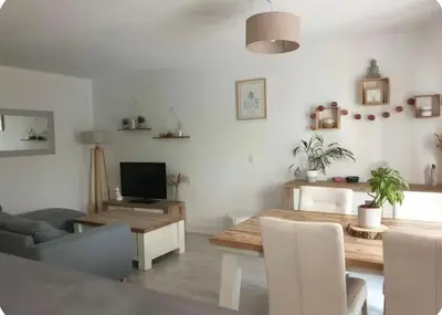a living room with a table and a couch at Appartement 3 pièces Aix-en-provence in Aix-en-Provence