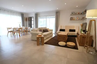 a living room with a couch and a table at Holiday rental with pool in the Alpilles for 6 people in Plan-dʼOrgon