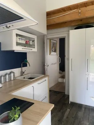 a kitchen with white cabinets and a sink at Ideal festival d'Avignon in Monteux