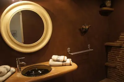 a bathroom with a sink and a mirror at Villa avec vue au pied du Luberon in Maubec