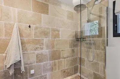 a bathroom with a shower with a glass door at Bali Style, Chic & Big Villa - Peaceful and Calm in Saint-Marc-Jaumegarde