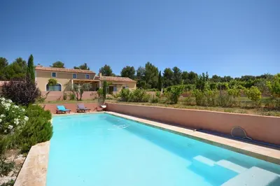 a swimming pool in front of a house at la Sainte Victoire in Jouques