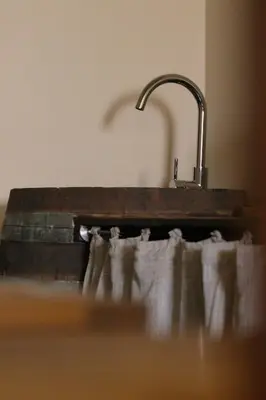a bathroom with a sink and a shower in a room at Le Petit Provençal in Sénas