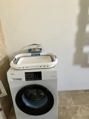 a washing machine with a dryer in a room at Villa situé à Sainte-Tulle in Sainte-Tulle