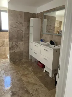 a bathroom with a white sink and a mirror at Villa situé à Sainte-Tulle in Sainte-Tulle