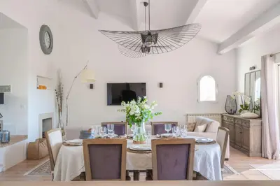 a dining room with a table and a ceiling at Mas Noves - Horizon Alpilles villa in Noves