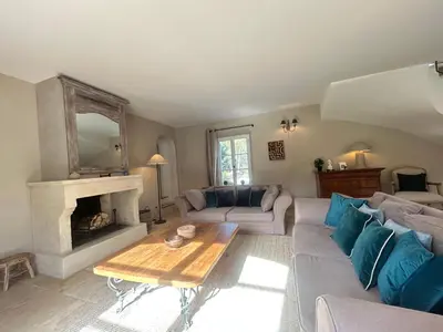a living room with a couch and a fireplace at Bastide Lavandin - Stunning Provencal Escape in Ventabren