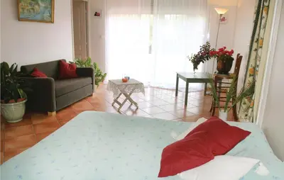 a living room with a bed and a couch at Beautiful Home In Lancon De Provence in Lançon-Provence