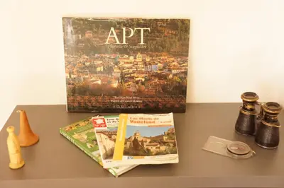a book sitting on top of a table at Longo Mai in Apt