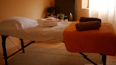 a bed with towels sitting on top of it at Château de la Gabelle Férrassières in Ferrassières