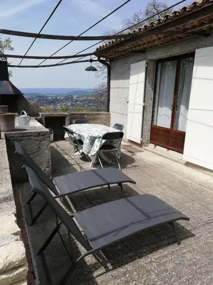 a patio with a table and two chairs and a table and a table and chairs at Mas Saint Louis in Saignon