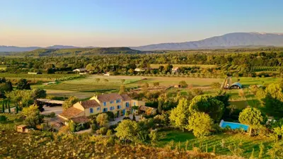 an aerial view of a house in the middle of a field at Bastide Saint-Didier in Saint-Didier