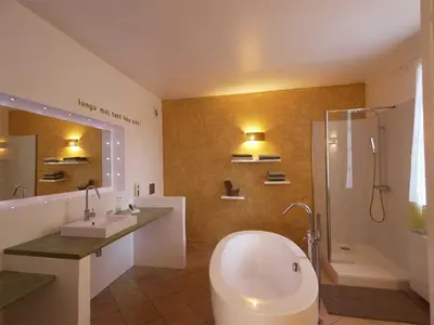 a bathroom with a toilet and a sink and a shower at Couleur Lavande in Le Thor