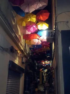 a bunch of umbrellas hanging from a ceiling at Gîte en Provence in Entraigues-sur-la-Sorgue